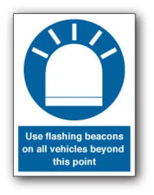 Use flashing beacons on all vehicles beyond this point